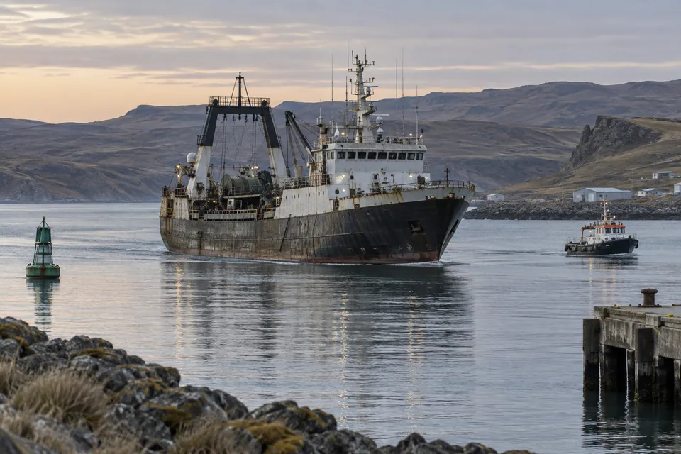 AI-generated illustration: A fishing vessel entering a sheltered Patagonian port.